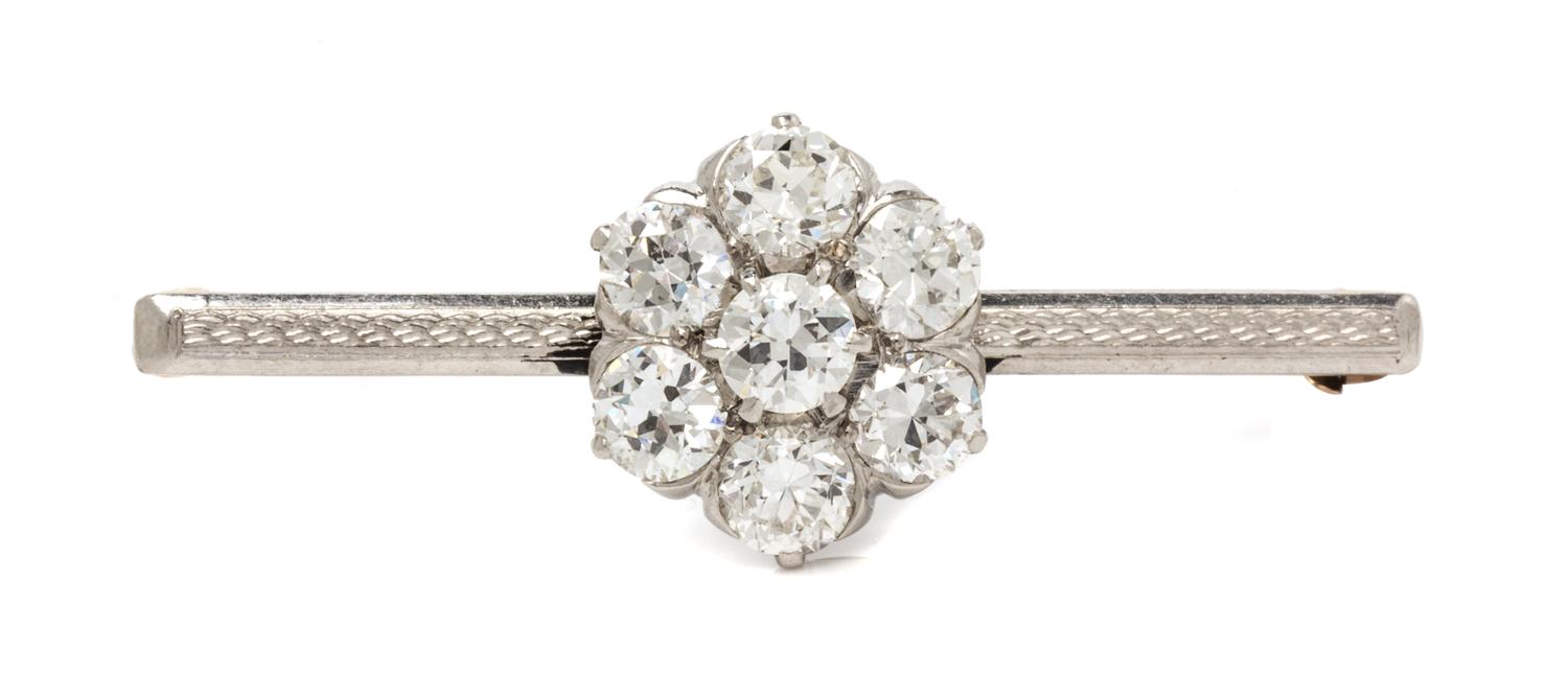 A Platinum Topped Yellow Gold and Diamond Cluster Pin, 3.80 dwts.
