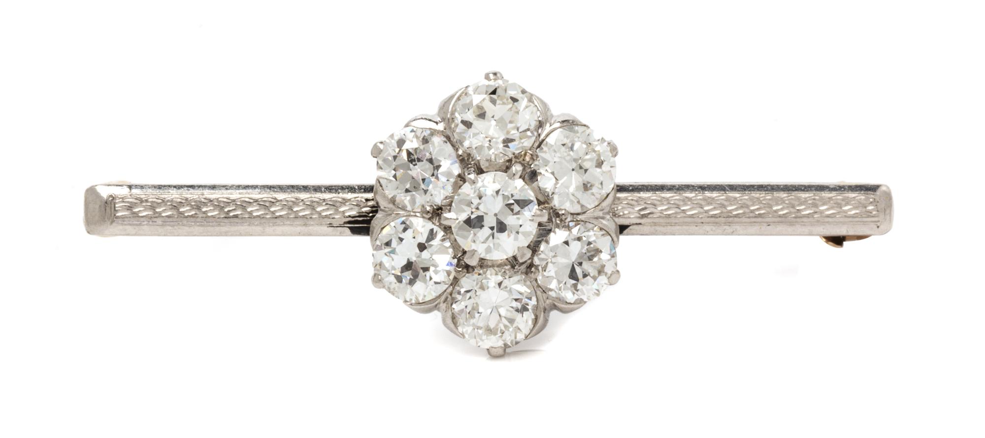 A Platinum Topped Yellow Gold and Diamond Cluster Pin, 3.80 dwts.