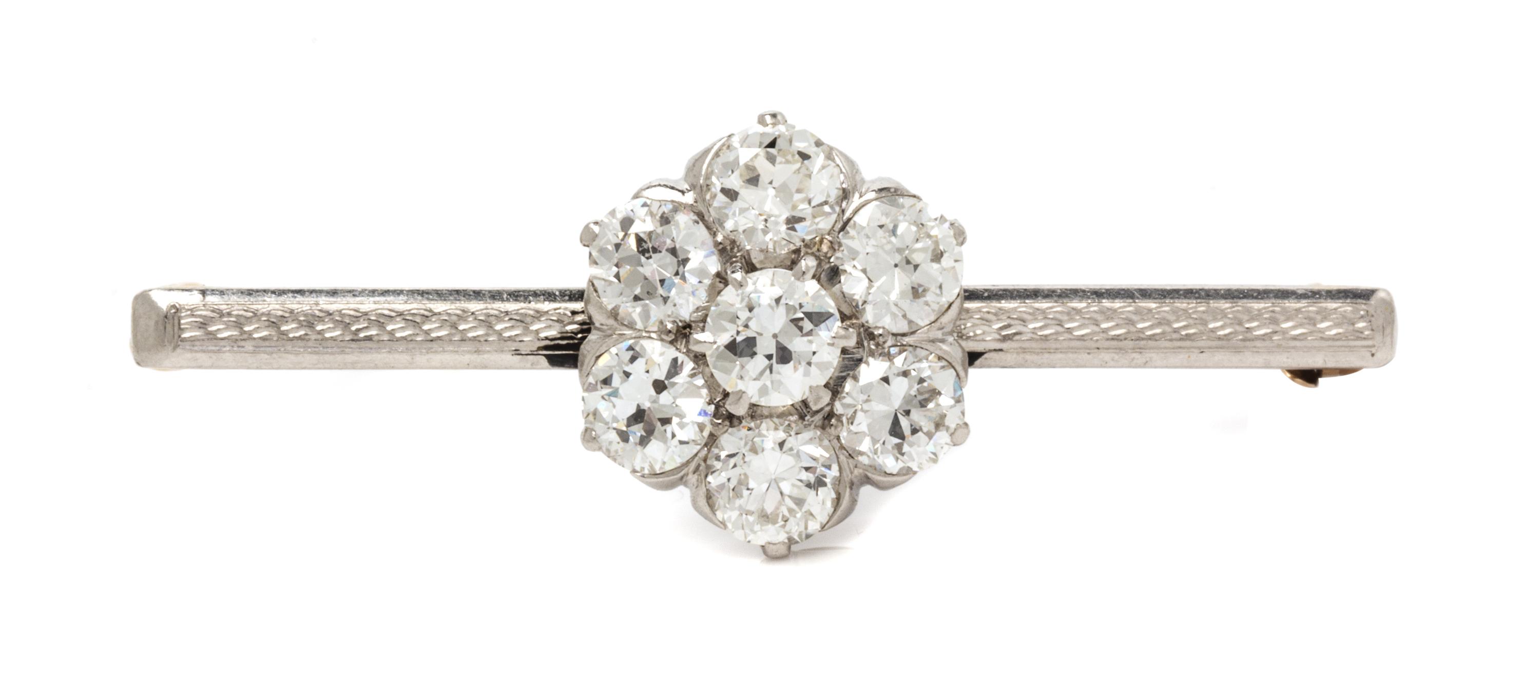 A Platinum Topped Yellow Gold and Diamond Cluster Pin, 3.80 dwts.