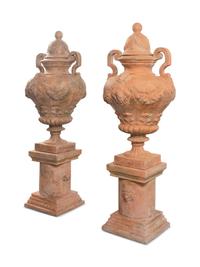 A Large Pair of Neoclassical Terra Cotta Covered Urns on Stands