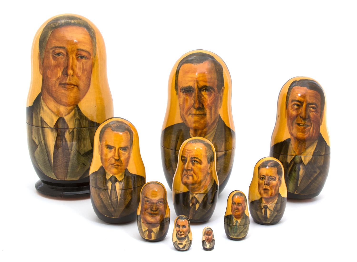 A Collection of Three Russian Bill Clinton Nesting Dolls Height of tallest 10 1/2 inches. — 20TH CENTURY