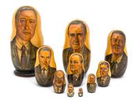 A Collection of Three Russian Bill Clinton Nesting Dolls Height of tallest 10 1/2 inches. — 20TH CENTURY