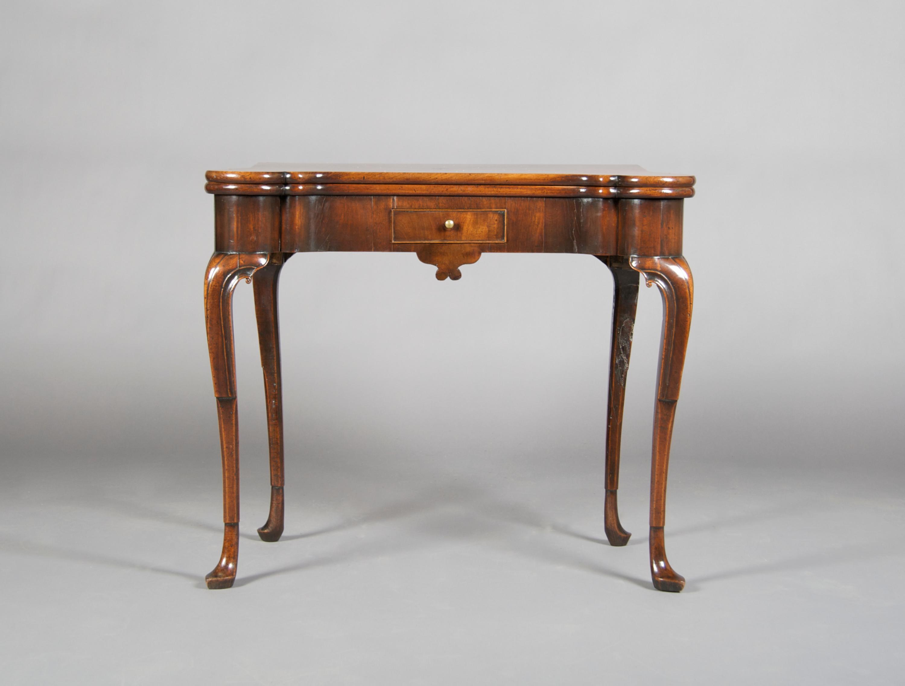 A Mahogany Games Table, Height 28 1/2 x width 33 1/2 x depth (closed) 16 1/2 inches.