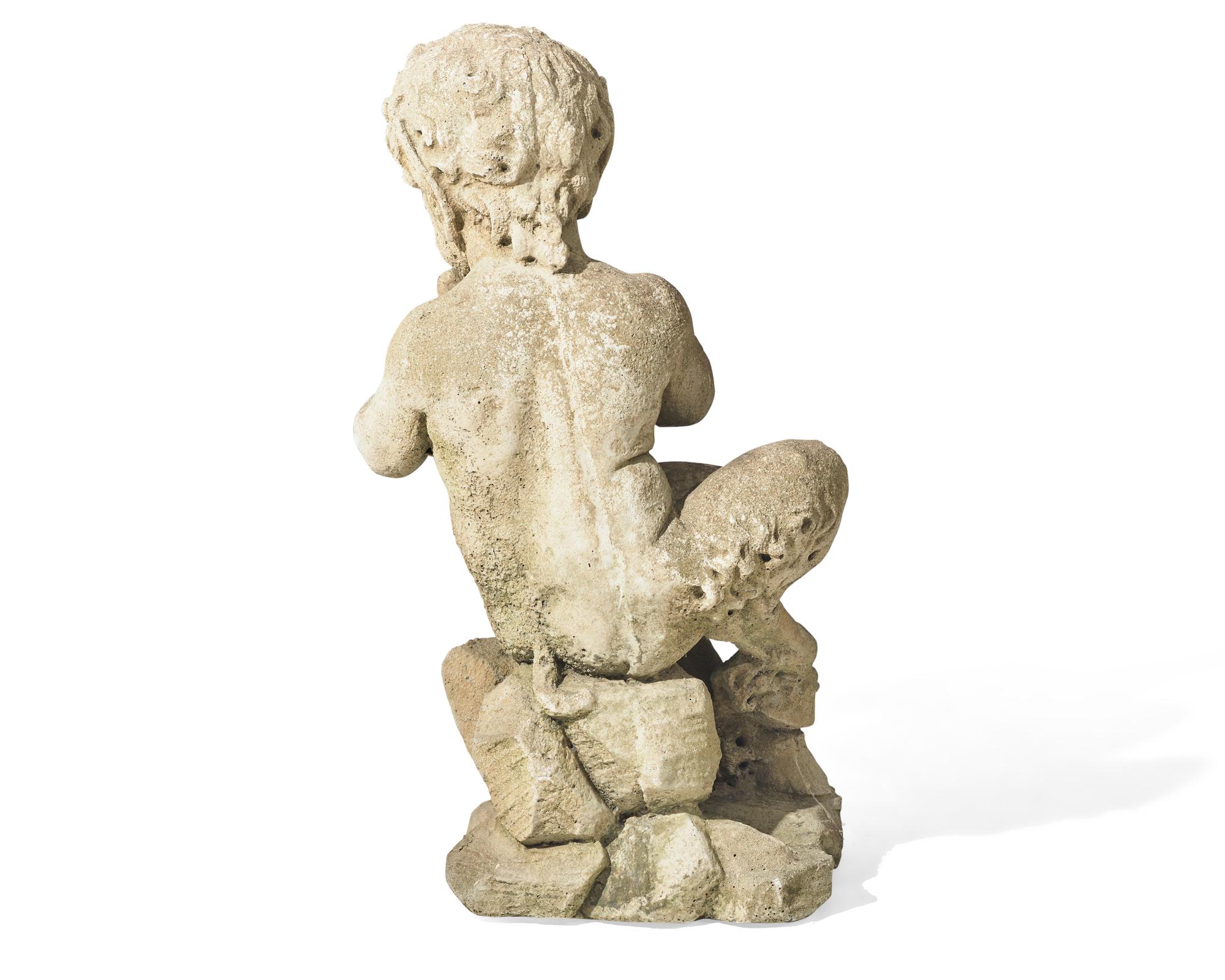 A small cast stone / concrete statue of a faun, early 20th century
