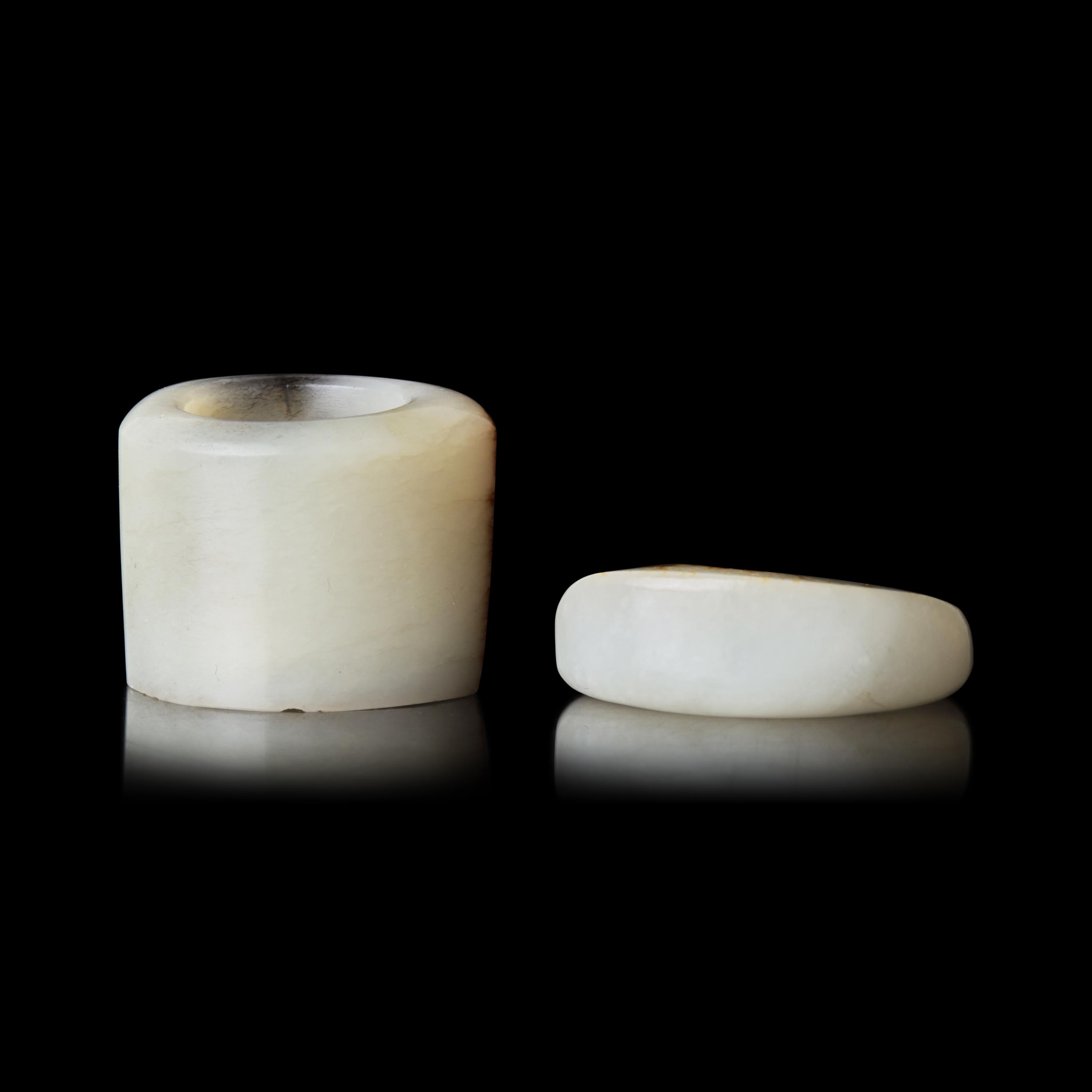 Two Chinese Russet and White Jade Archer's Rings, Qing Dynasty 清 白玉留皮扳指兩枚