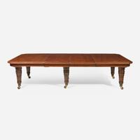 An English Aesthetic Movement carved oak dining table and set of twelve dining chairs Lamb of Manchester, Manchester, England, circa 1875