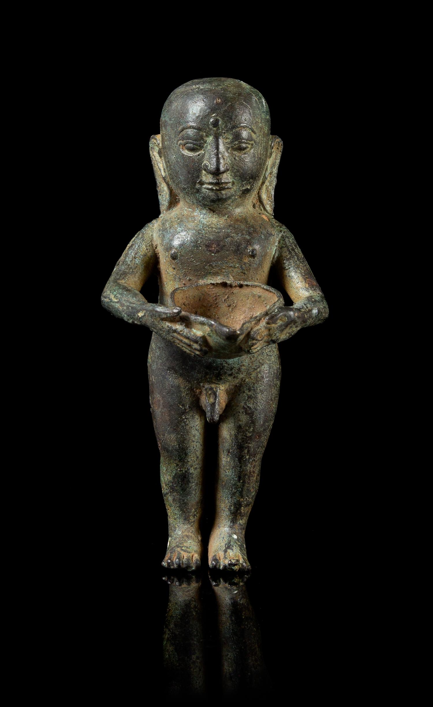 A Bronze Figure of a Buddha Boy