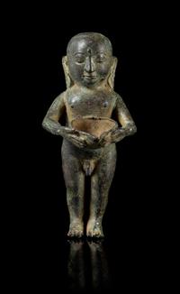A Bronze Figure of a Buddha Boy