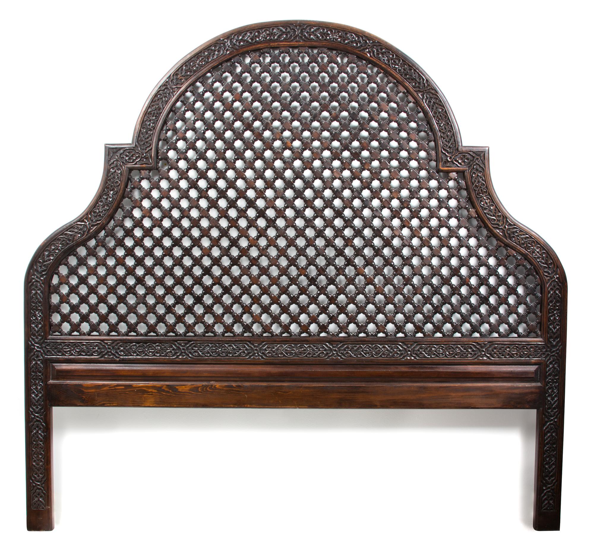 An Indian Carved Wood Queen Headboard Height 74 x width 79 inches.