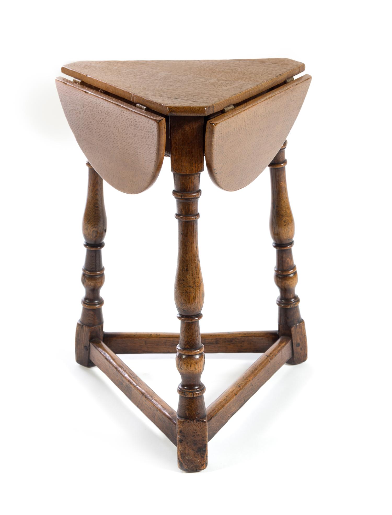 A Jacobean Style Oak Drop-Leaf Table Height 22 inches. — 20TH CENTURY