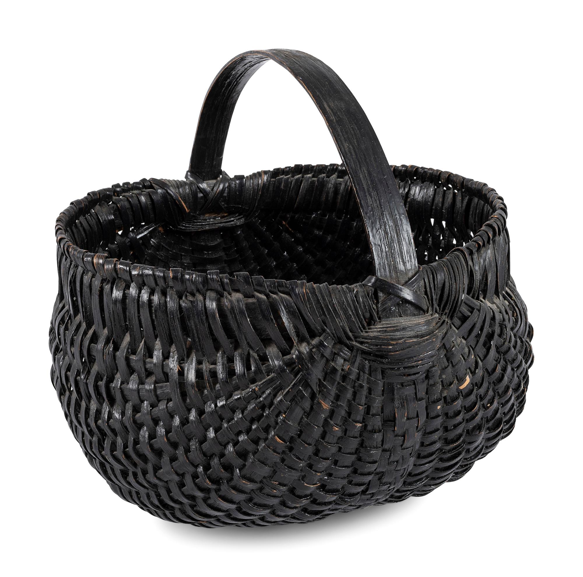 A Woven Buttocks Basket in Black Paint