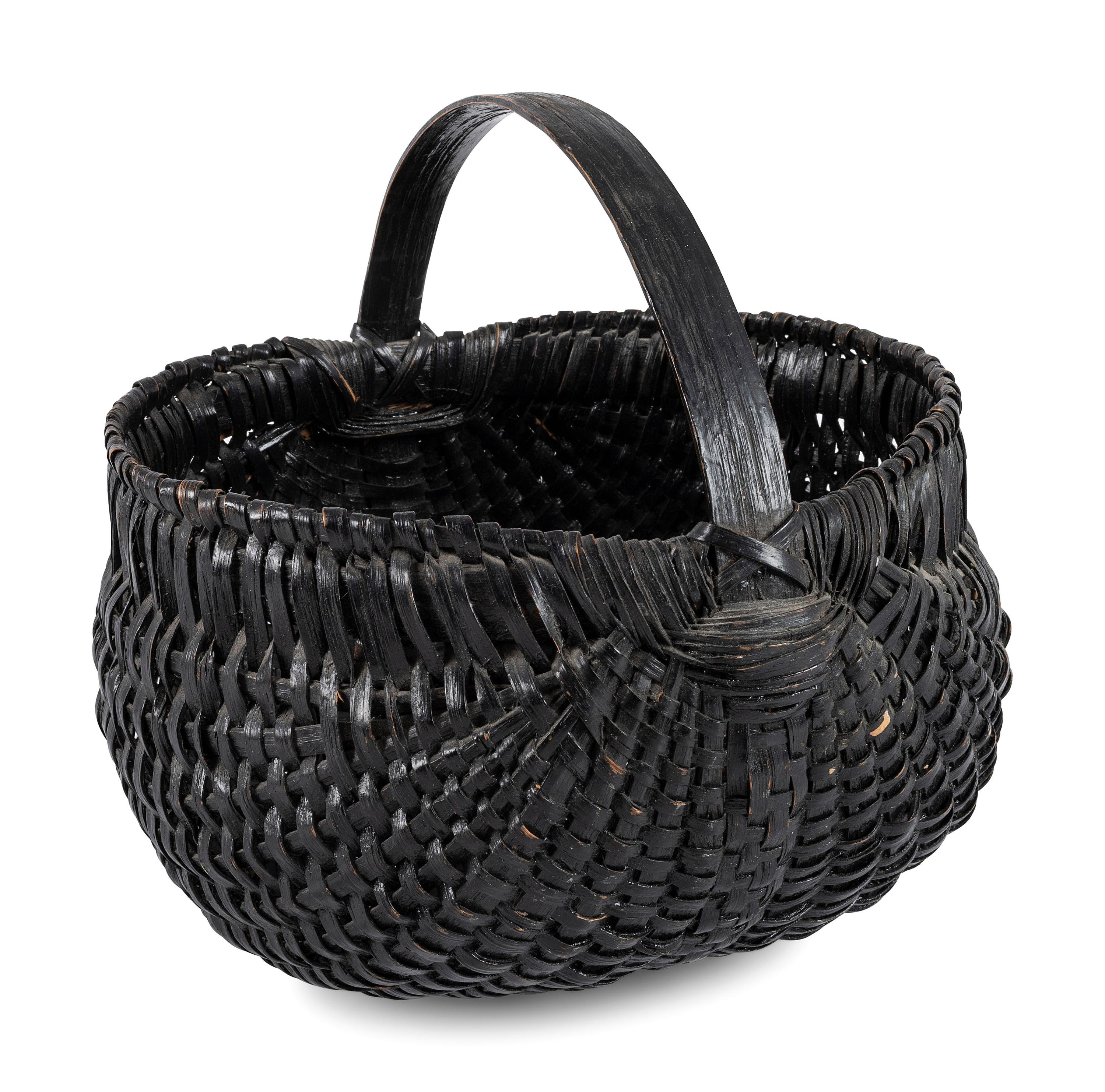 A Woven Buttocks Basket in Black Paint