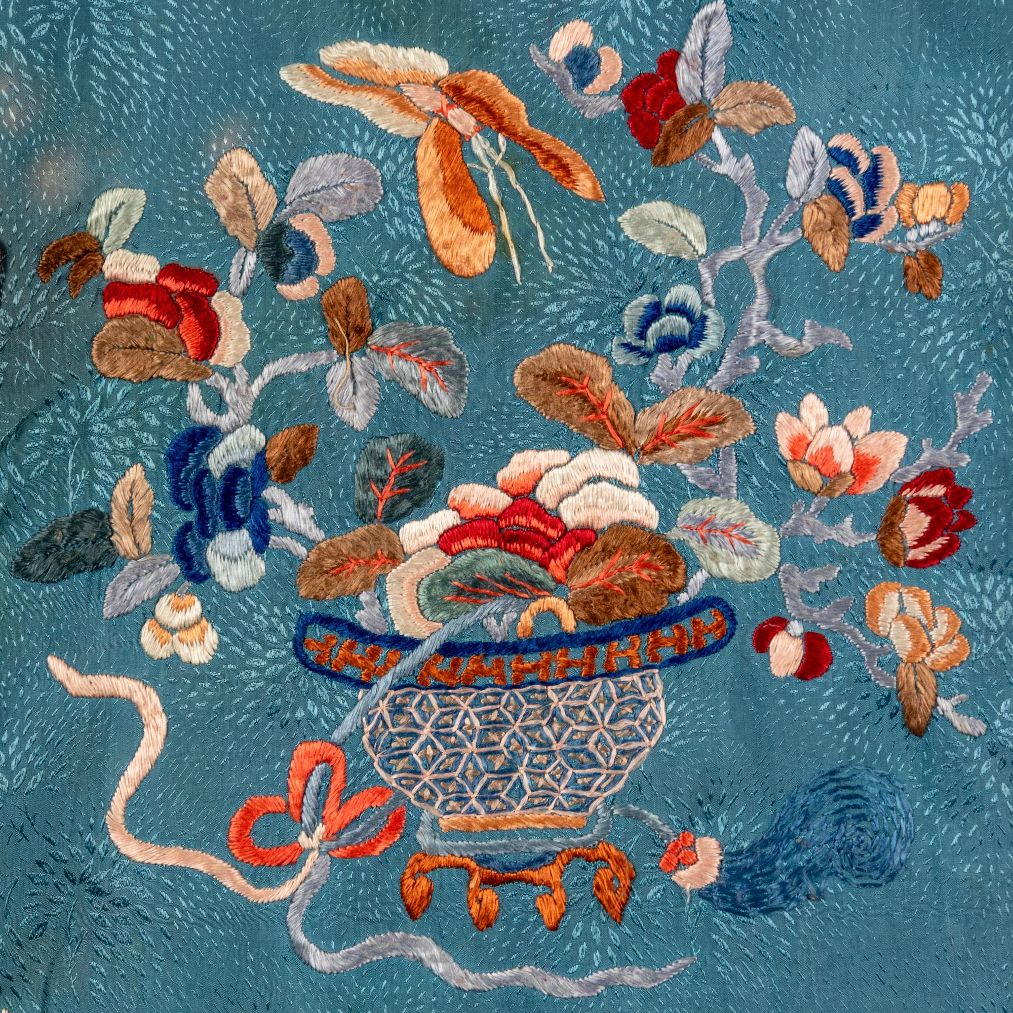 A Chinese Celeste Blue Ground Embroidered Silk Lady's Jacket 清晚期 藍地牡丹花籃紋褂