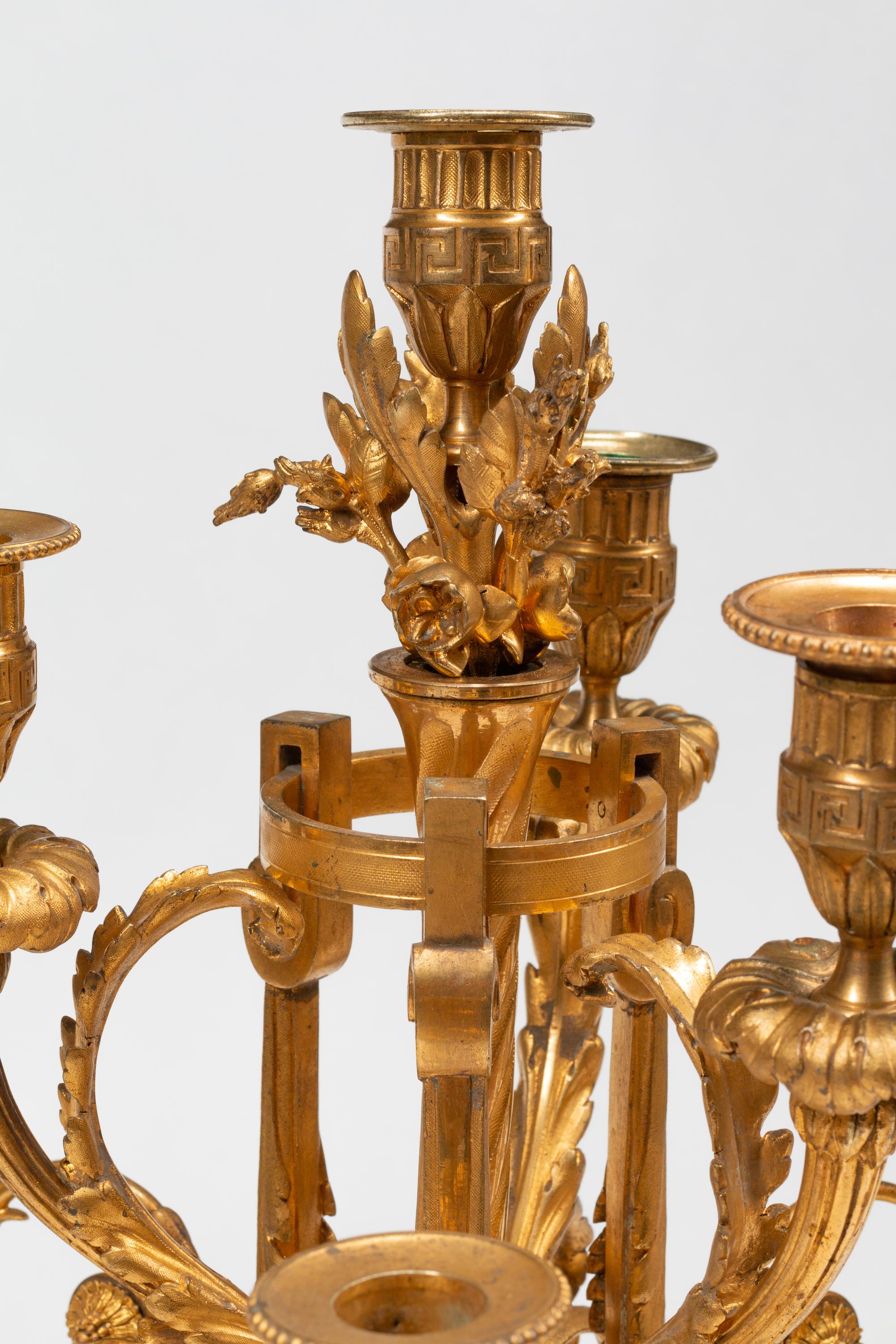 A Pair of Louis XVI Style Gilt Bronze and Marble Seven-Light Candelabra