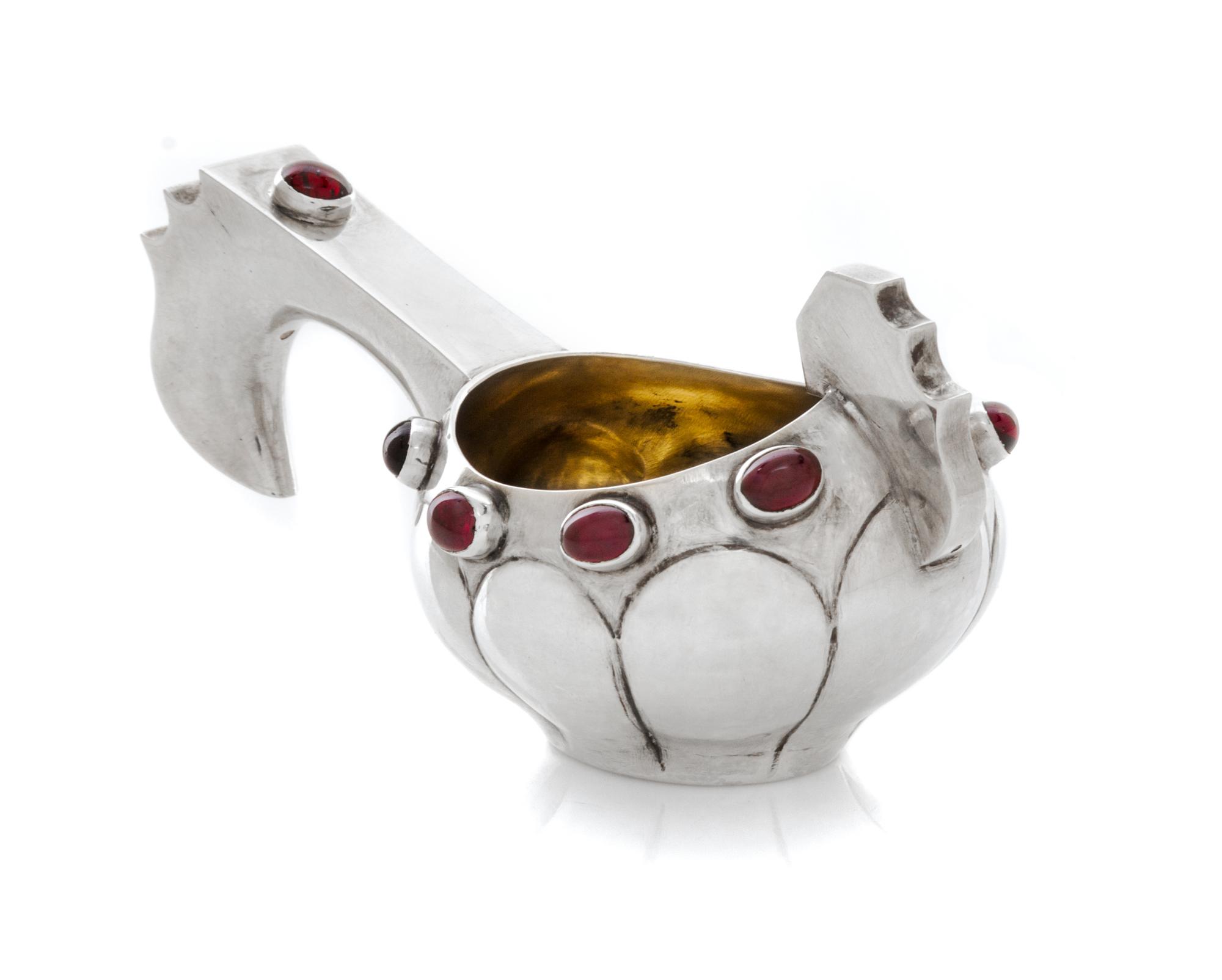 A Russian Silver and Jeweled Kovsh, Mark of K. Faberge, kokoshnik mark obscured, late 19th/early 20th century, having a lobed body, the