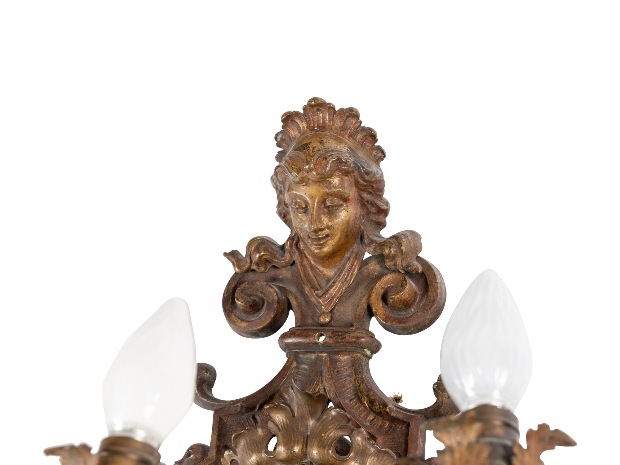 A Pair of Régence Style Gilt Metal Five-Light Sconces