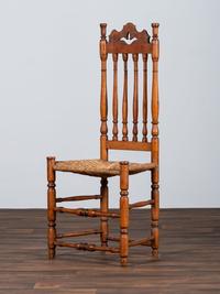 A William and Mary Style Turned and Pierced Carved Banister-Back Rush Seat Side Chair