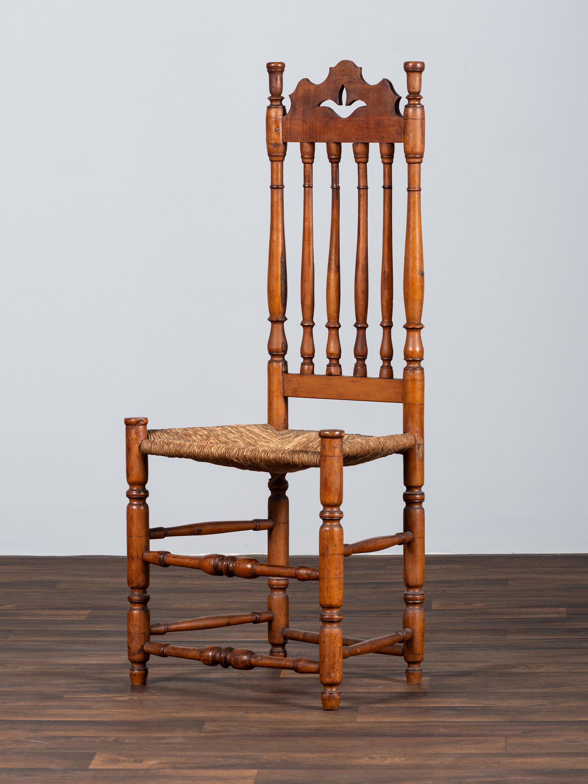 A William and Mary Style Turned and Pierced Carved Banister-Back Rush Seat Side Chair