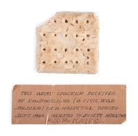 Civil War hardtack received by identified veteran in September 1864 with historical society tag.