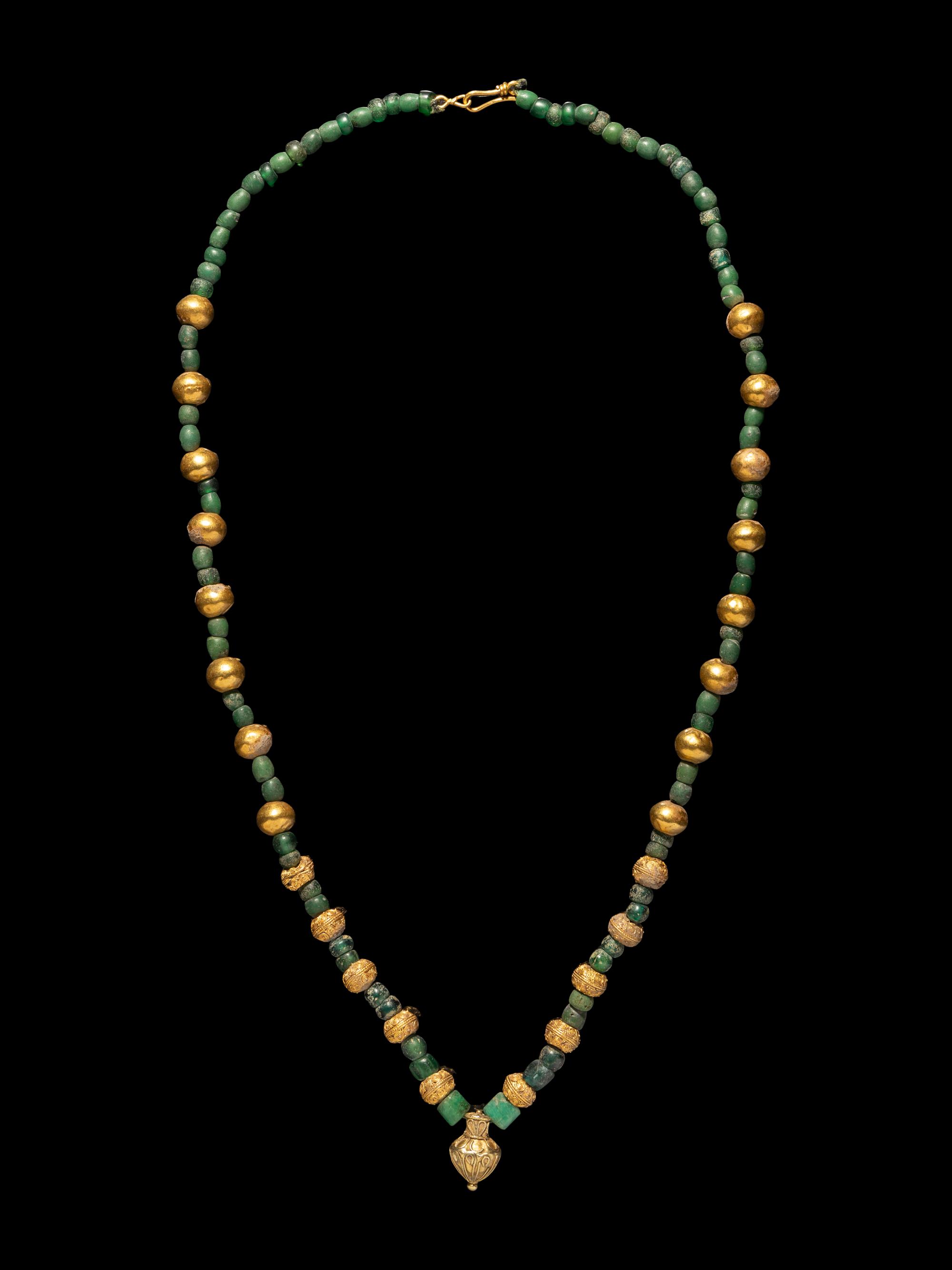 A Greek Gold, Emerald, and Glass Necklace with an Amphora-Shaped Pendant