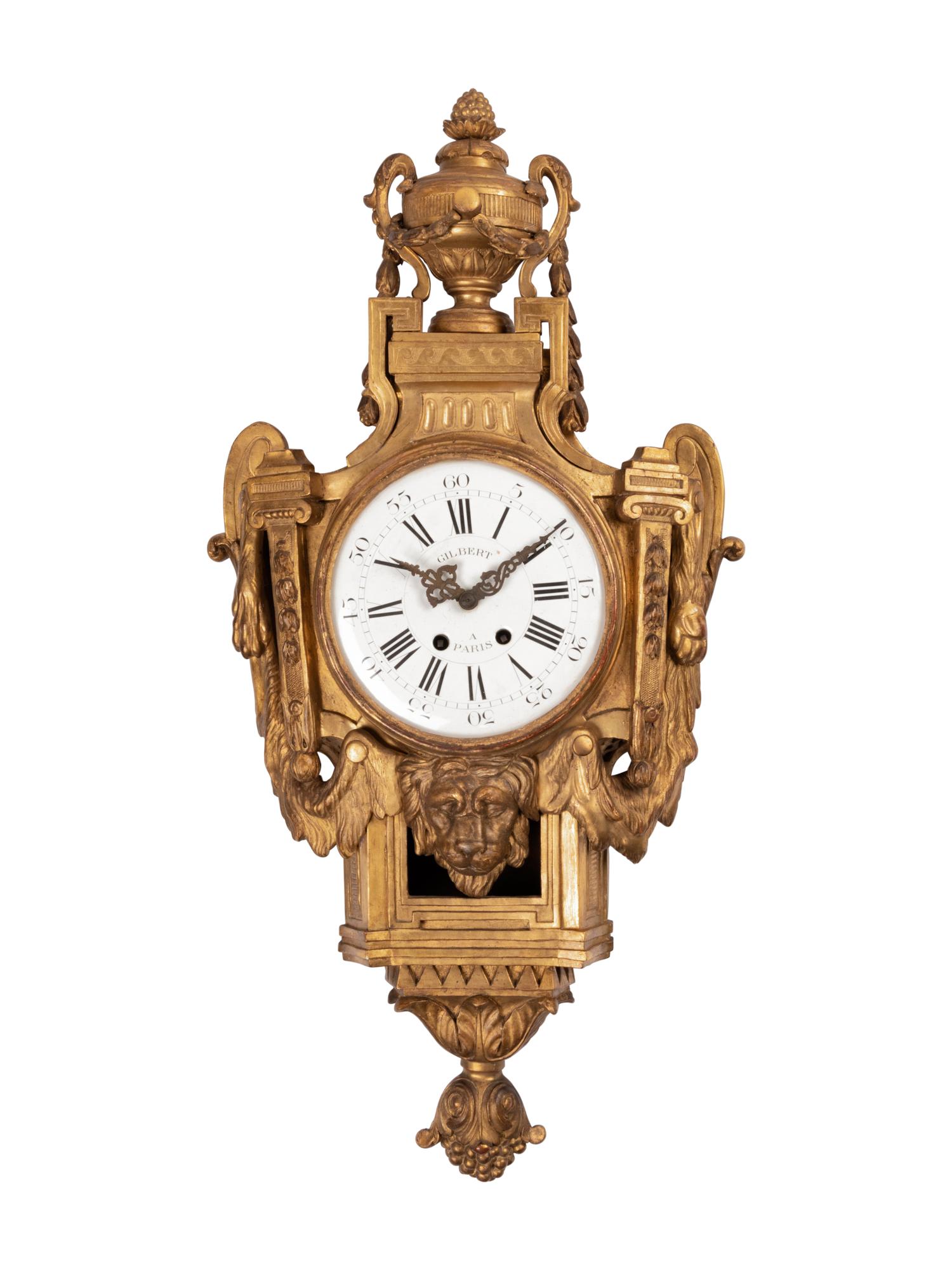 A Louis XVI Style Giltwood Cartel Clock
