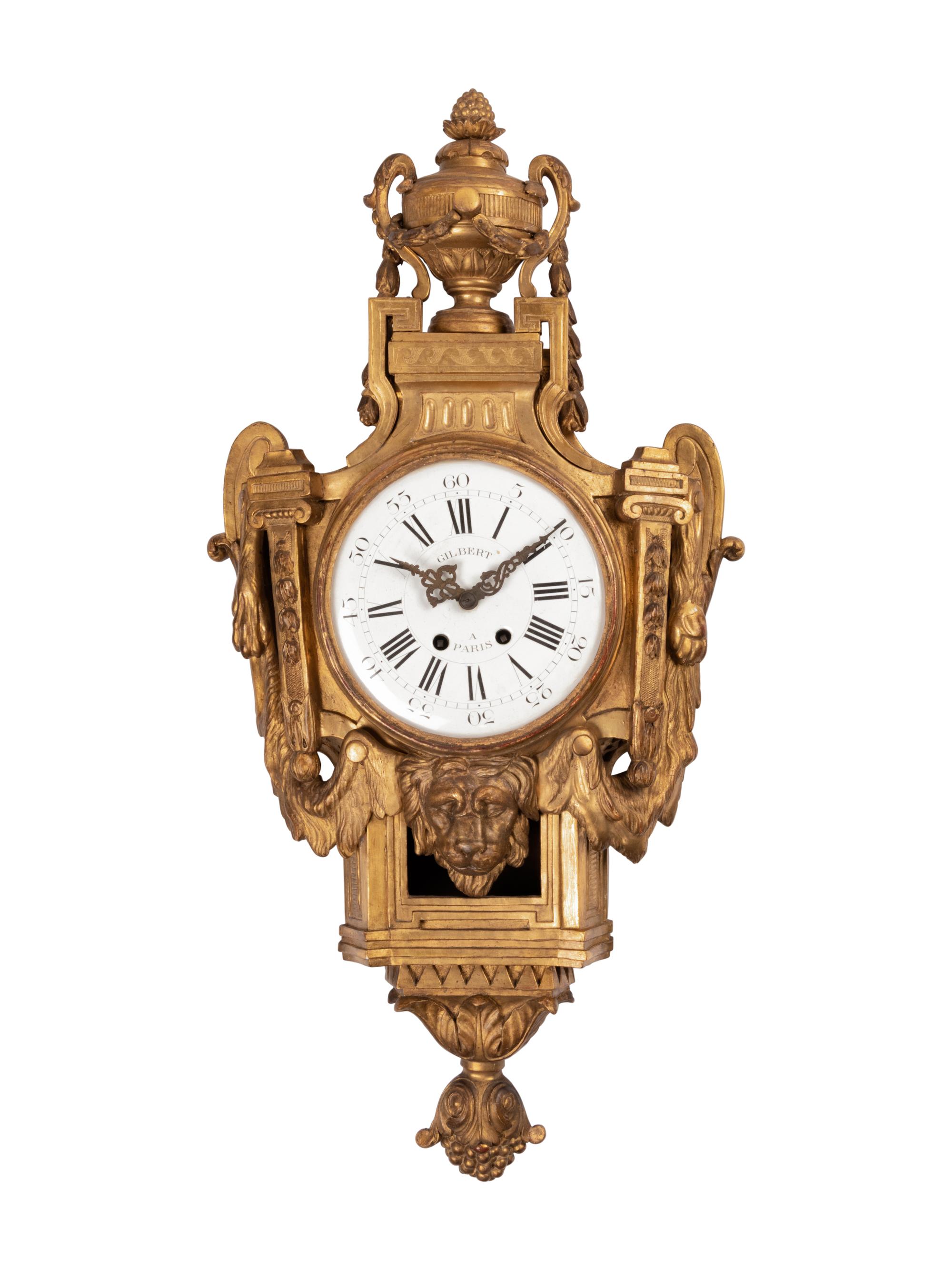 A Louis XVI Style Giltwood Cartel Clock