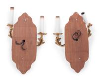 A Pair of Louis XV Style Gilt Metal Two-Light Sconces on Walnut Plaques