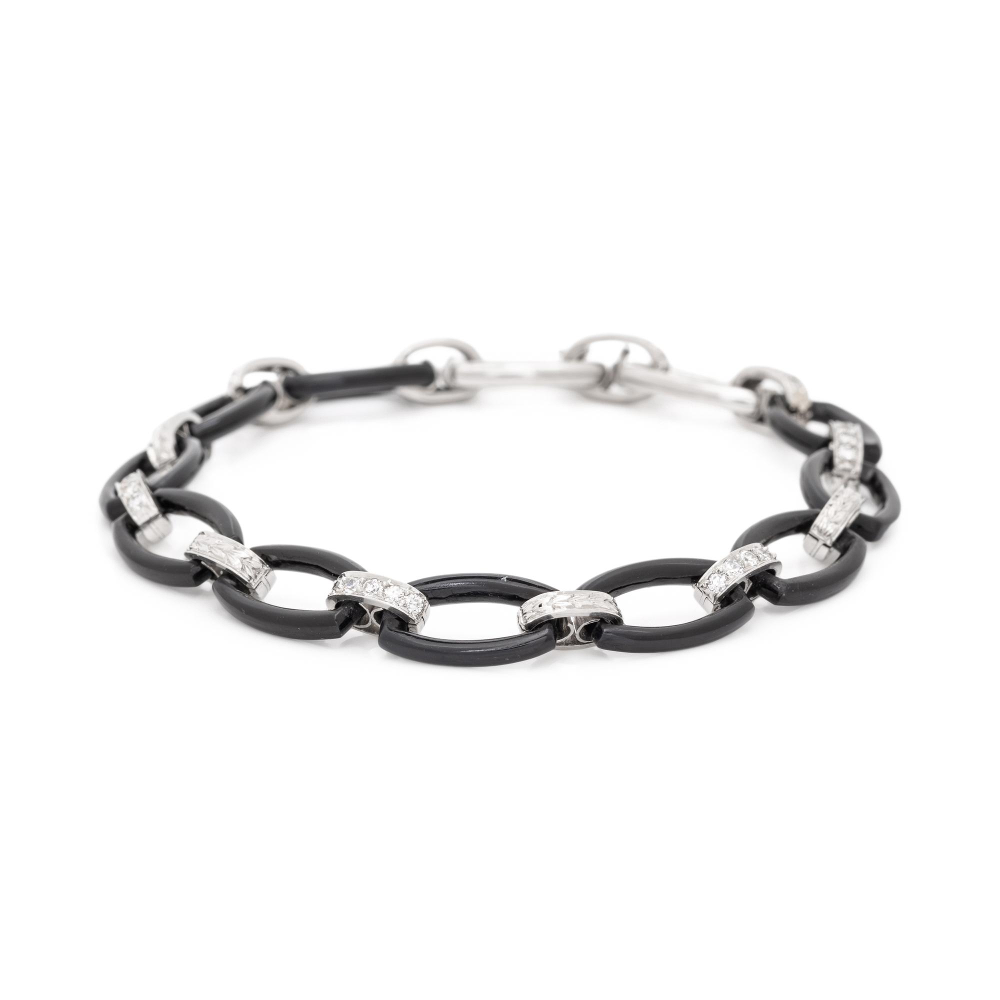 ART DECO, PLATINUM, ONYX AND DIAMOND BRACELET