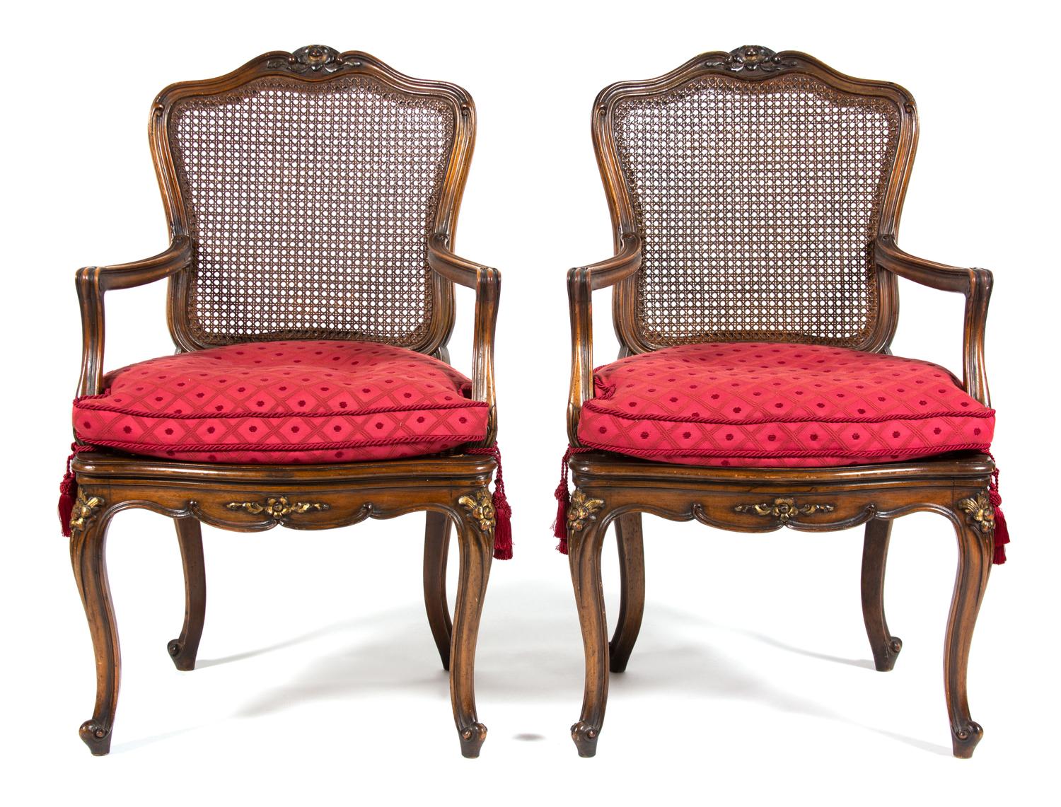 A Pair of Louis XV Provincial Style Carved Walnut Fauteuils Height 39 inches. — 19TH CENTURY