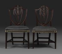 A Pair of Federal Carved Mahogany Shield-Back Dining Chairs