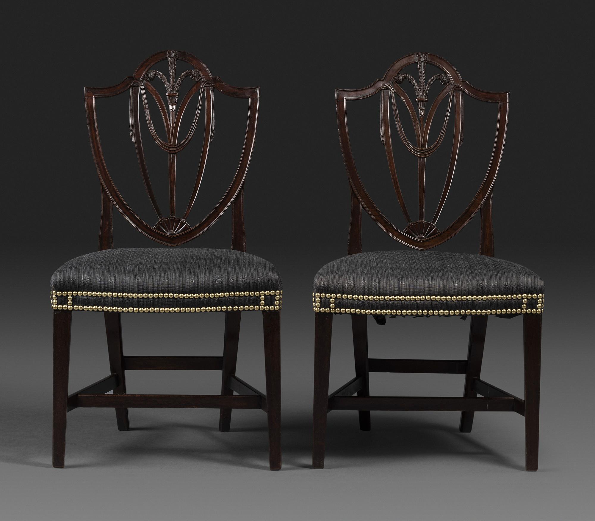 A Pair of Federal Carved Mahogany Shield-Back Dining Chairs