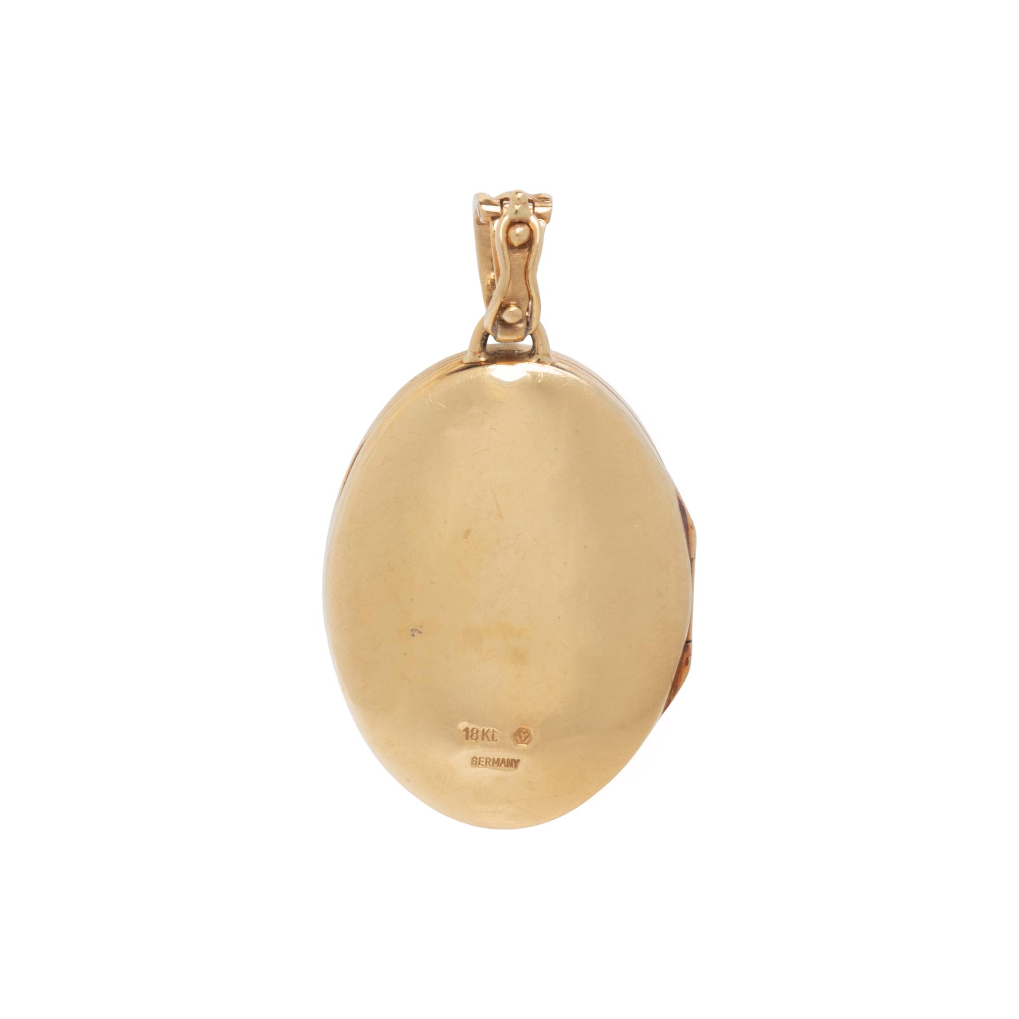 YELLOW GOLD, DIAMOND, AND ENAMEL LOCKET