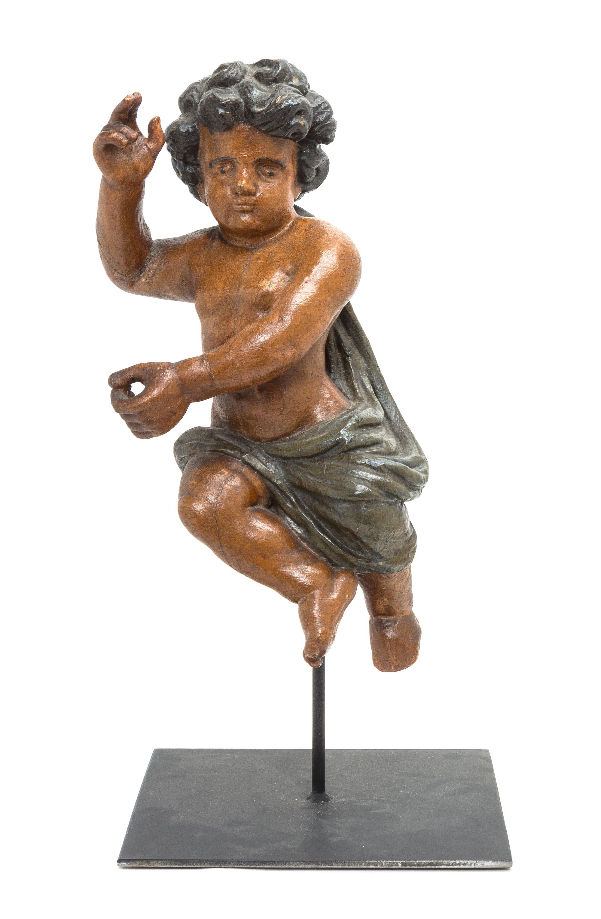 A Continental Carved Wood Figure of a Putto, 19TH/20TH CENTURY, Height of figure 19 1/4 inches. — 19TH/20TH CENTURY,