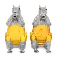A Pair of Silver-Plate and Yellow Glass Squirrel Decanters