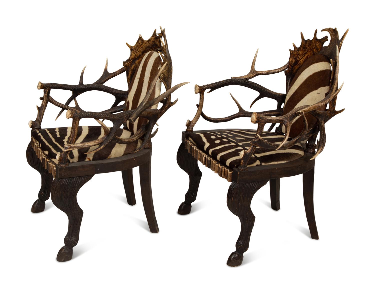 A Pair of Stag Antler Arm Chairs with Zebra Hide Upholstery Attributed to Anthony Redmile