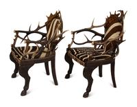 A Pair of Stag Antler Arm Chairs with Zebra Hide Upholstery Attributed to Anthony Redmile