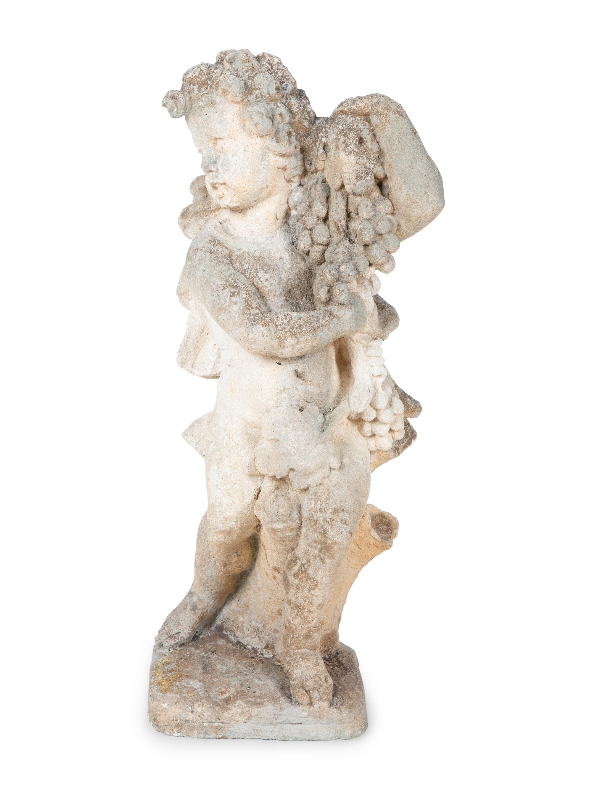 A Cast Stone Figure of Cherub Holding Grapes — 20TH CENTURY