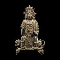 A Chinese Parcel-Gilt Bronze Figure of Guanyin, Ming Dynasty 明 銅局部鎏金觀音坐像