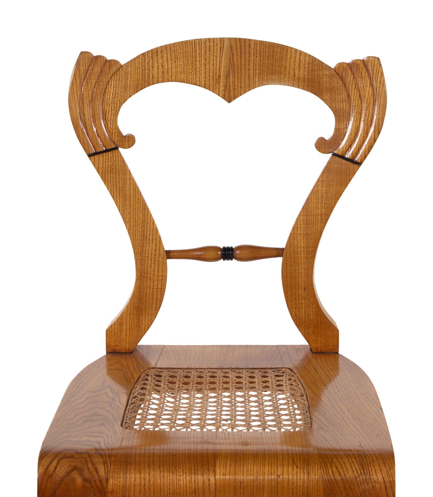 A Set of Four Biedermeier Oak Side Chairs