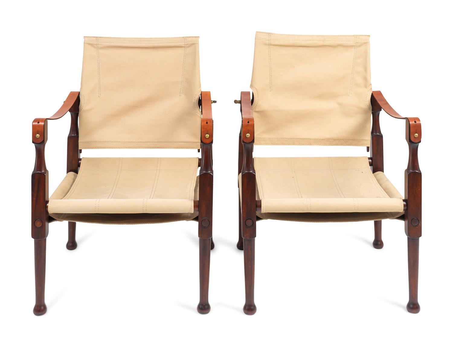 A Pair of British Colonial Style Mahogany, Canvas and Leather Strap Campaign Chairs — 20TH CENTURY