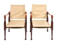 A Pair of British Colonial Style Mahogany, Canvas and Leather Strap Campaign Chairs — 20TH CENTURY