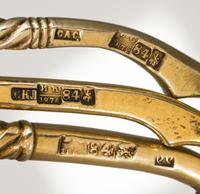 Three Russian Silver-Gilt Serving Spoons, Marks of S. Stroganov, Stepan Levin and GAC, Moscow, 19th century, each having a twist handle