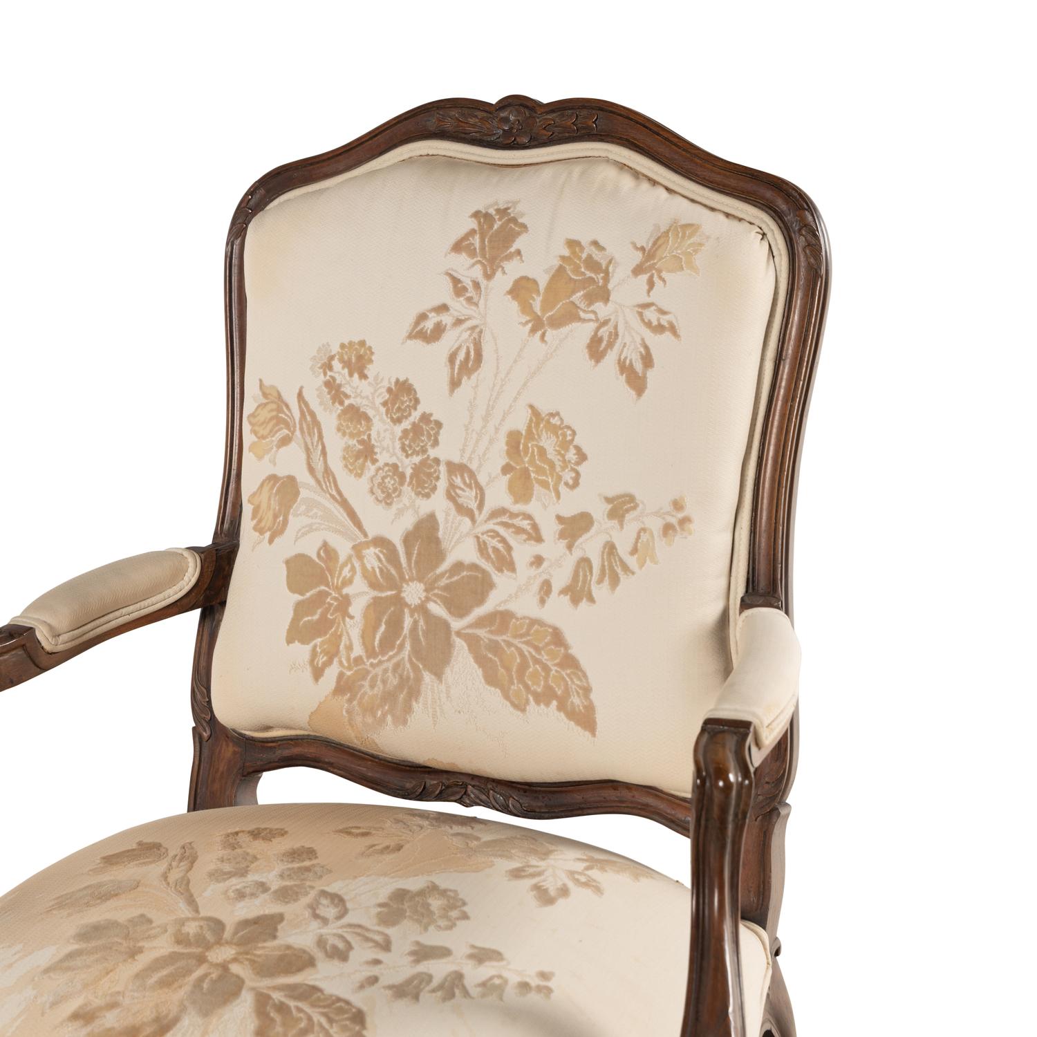 A Louis XV Style Carved Walnut Fauteuil