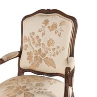 A Louis XV Style Carved Walnut Fauteuil