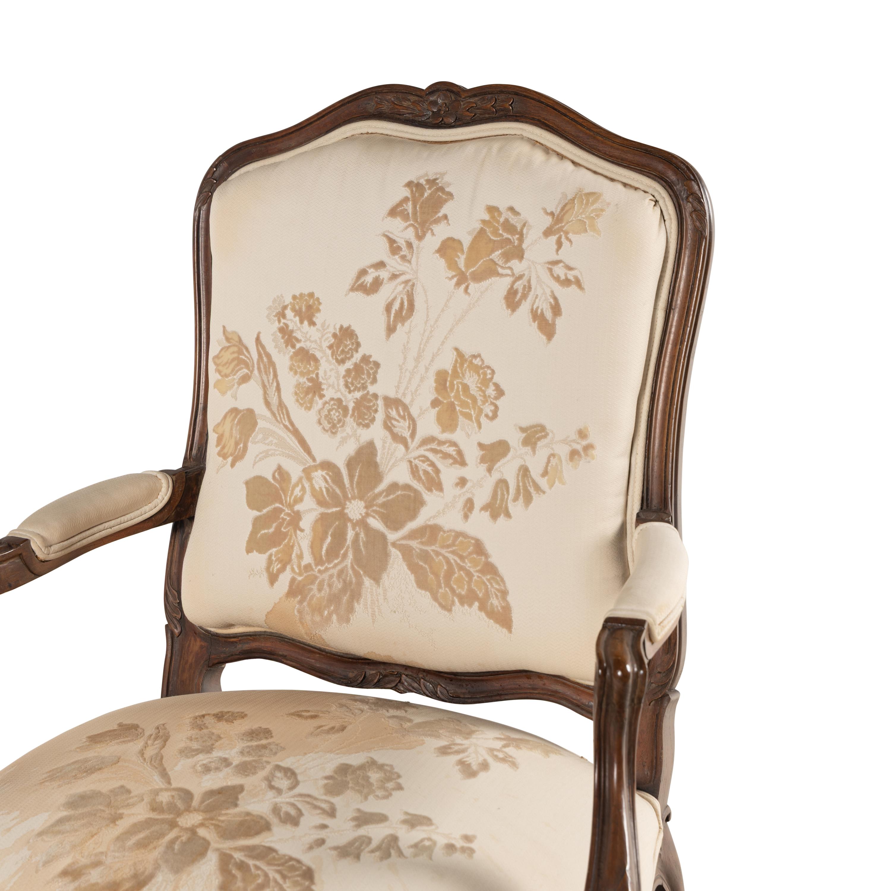 A Louis XV Style Carved Walnut Fauteuil