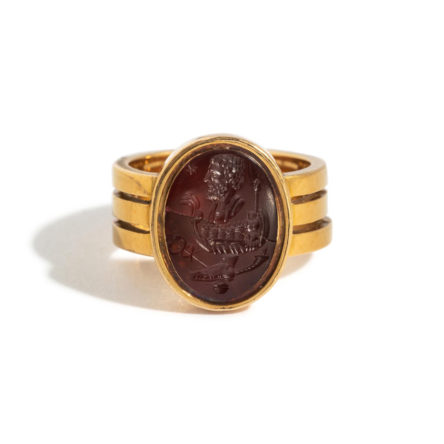 A Carnelian Ring Stone with an Allegorical Scene, After the Antique — Set in a gold ring; Hallmarks stamped on the back