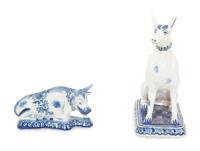 A Delft Blue and White Seated Dog and a Recumbent Cow