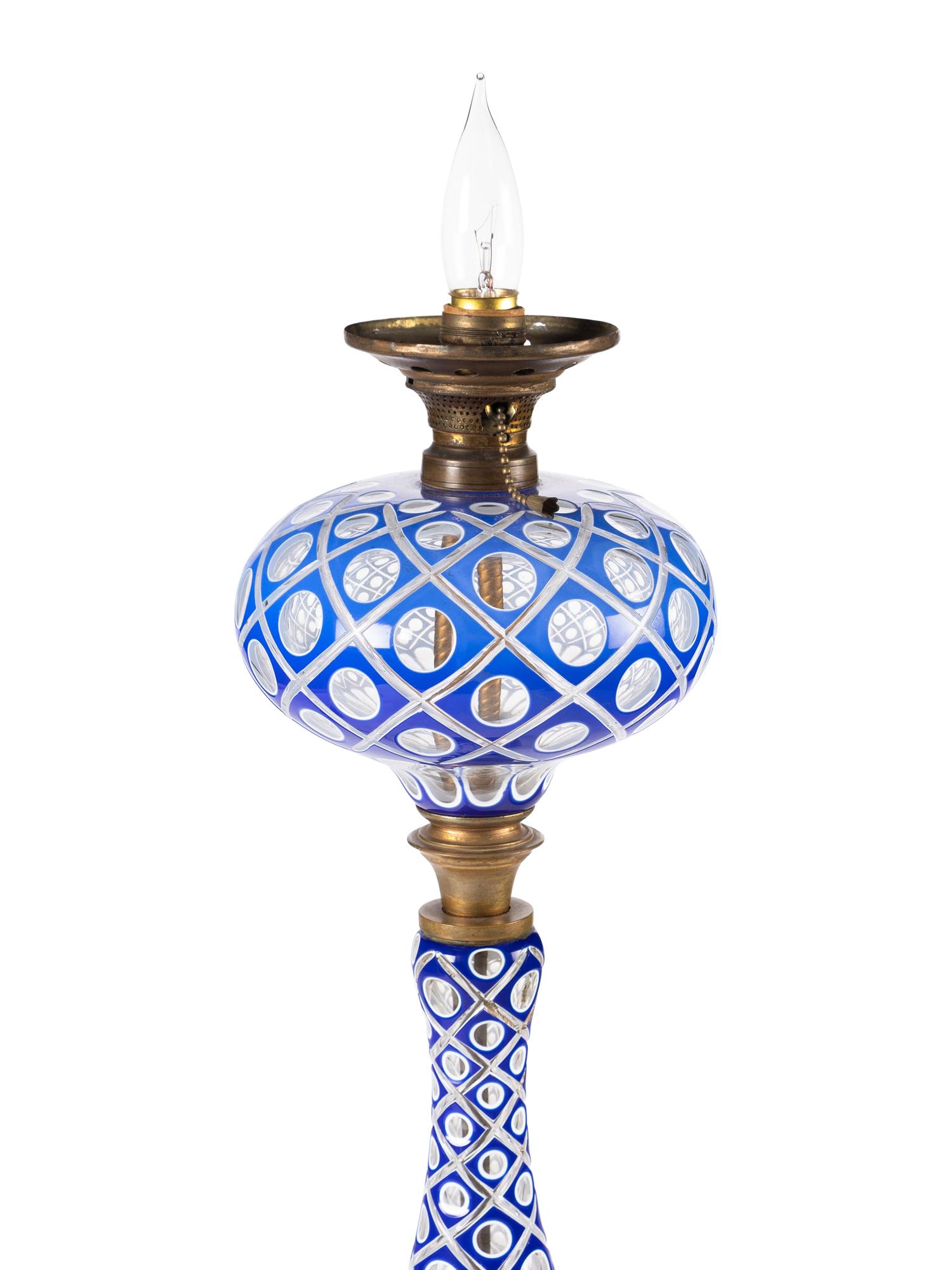 A Blue and White Overlay Cut to Clear Glass Fluid Lamp