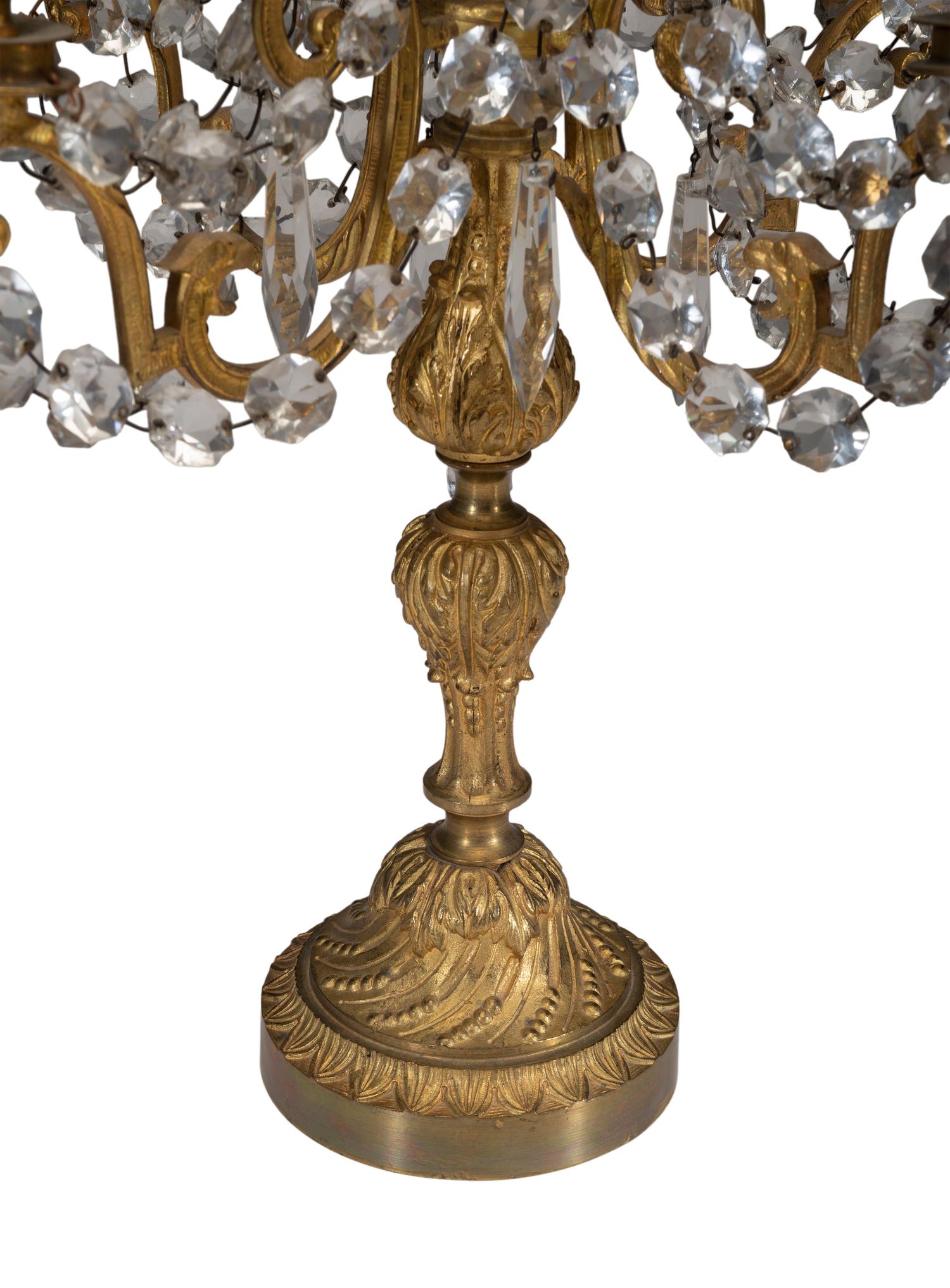 A Pair of Gilt-Bronze and Crystal Five-Light Candelabra