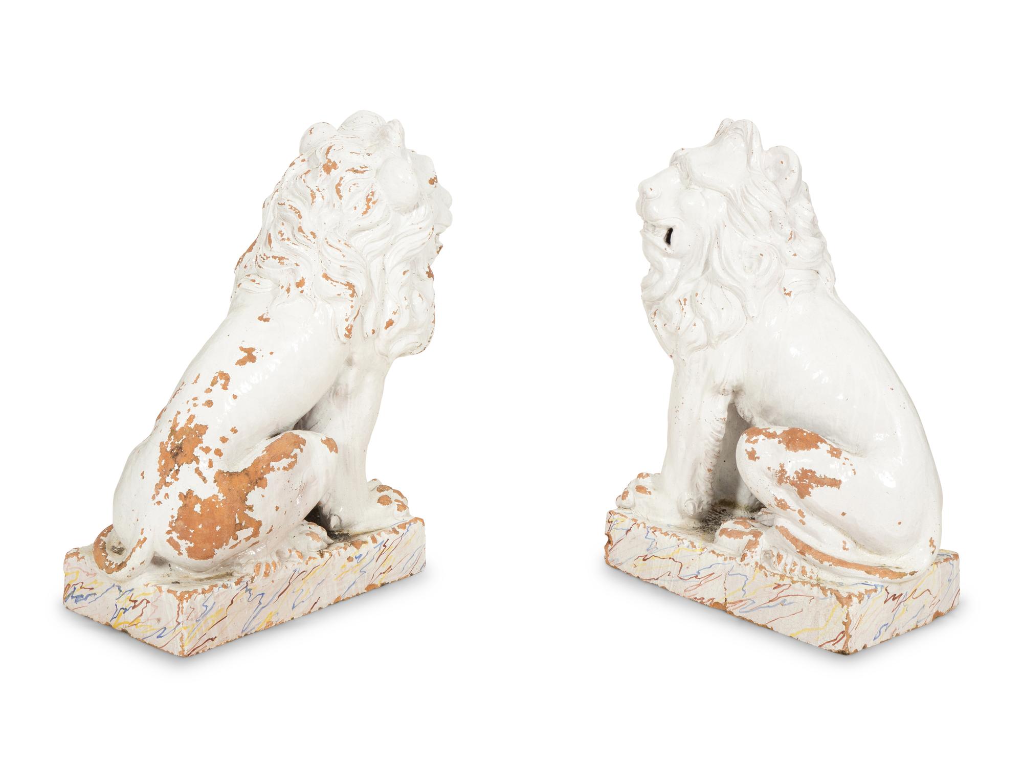 A Pair of Italian White Glazed Ceramic Seated Lions
